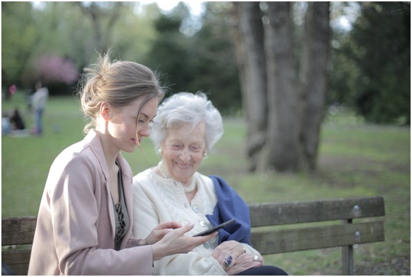 A daughter spending time with her elderly mother