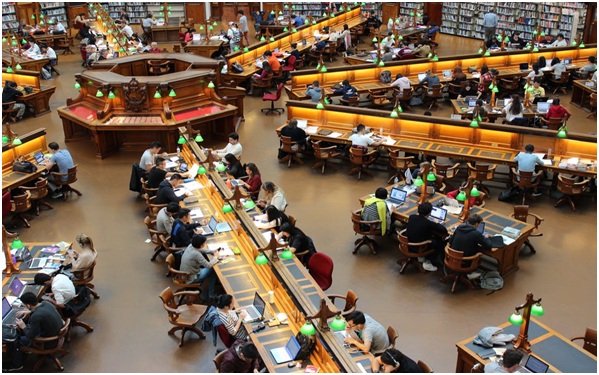 Packs of students studying in a library